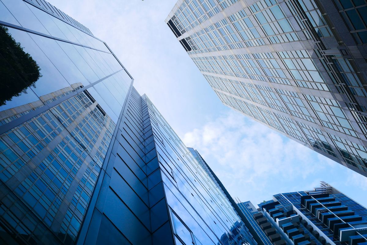 Glass office towers seen from street level