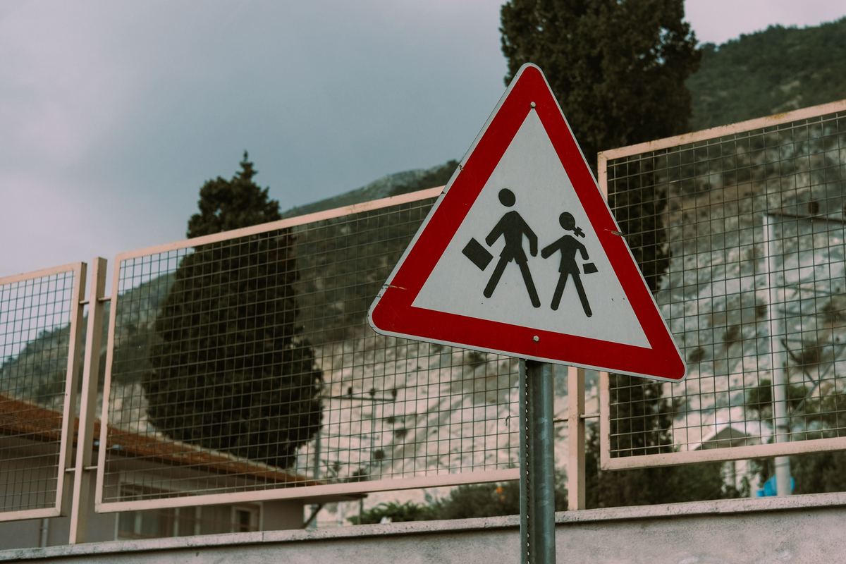 A school crossing warning sign